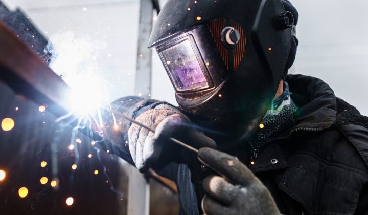 Thompson Repairs team fabricating a custom metal component in an industrial welding shop.